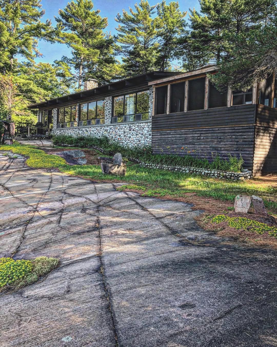Main Lodge exterior with stone facade and granite grounds