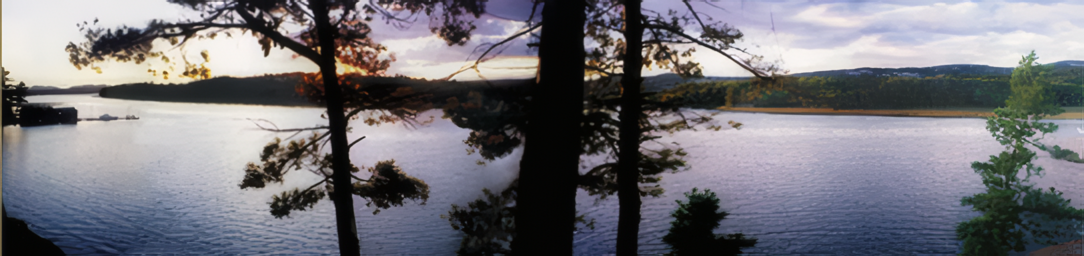 Sunset over Georgian Bay with dock and canoe at Shebanoning Lodge, Killarney Ontario